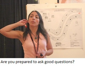 An educator invites questions from her class.